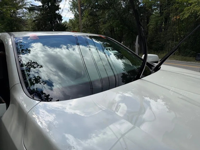 Completed windshield replacement on a white 2017 Acura MDX